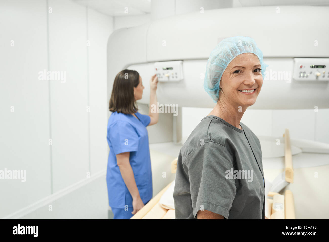 Portrait Of Happy Mature Woman Smiling As Patient In Clinic Stock Photo