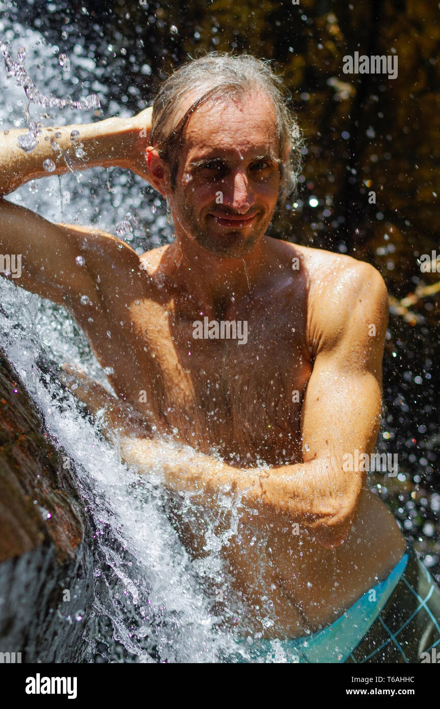 Young man taking shower hires stock photography and images Alamy