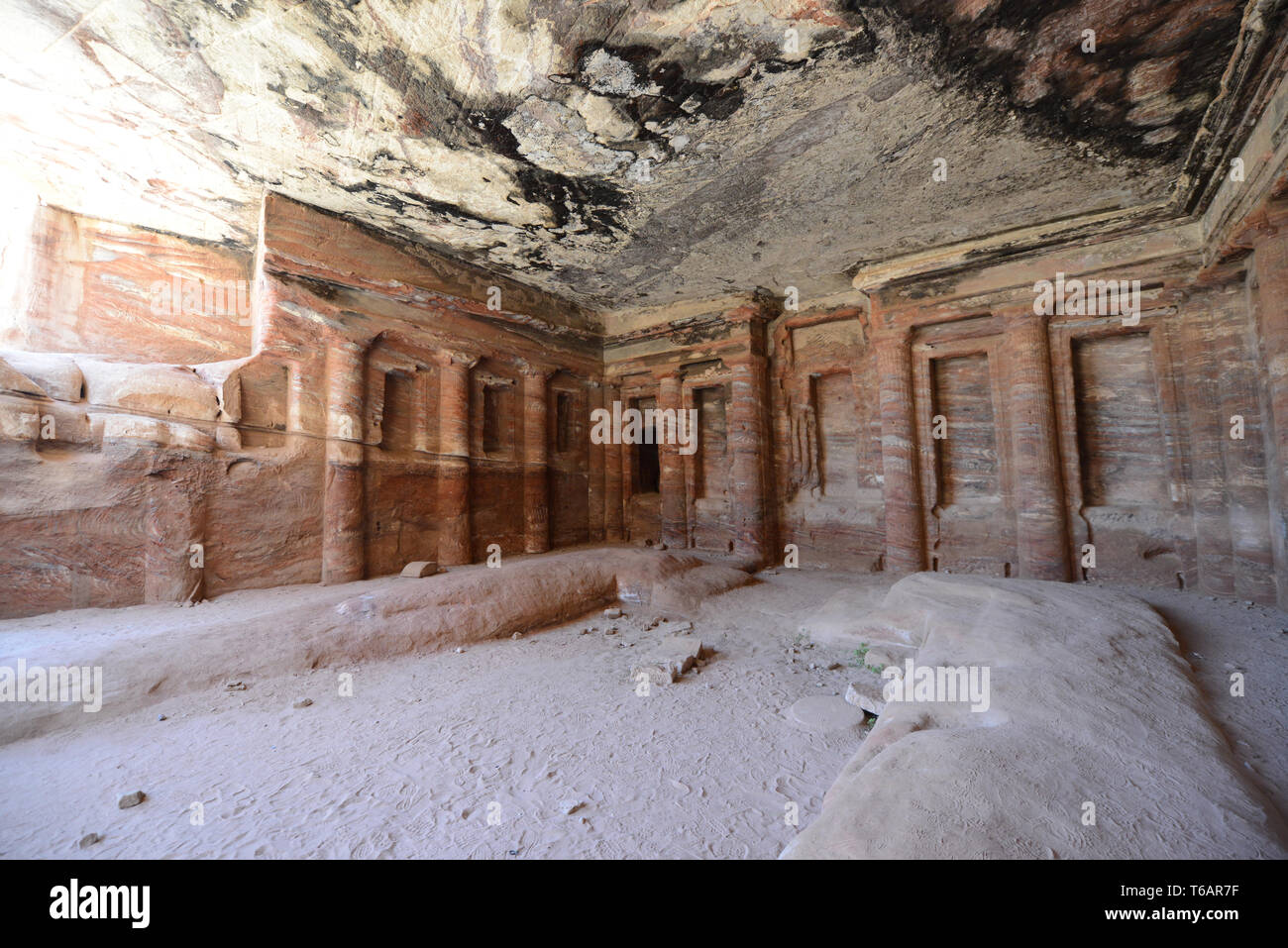 Inside an ancient Nabataean chamber carved in the rock. Stock Photo