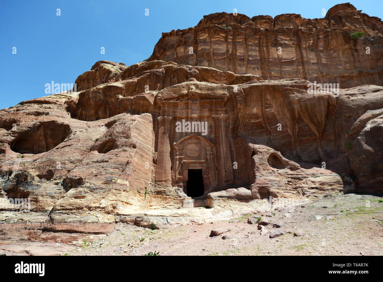 Petra Inscriptions Rock carved chambers and tombs in the ancient Nabataean city of Petra ...
