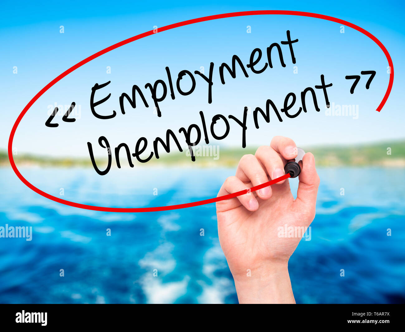 Unemployed Writing Man Hand writing Employment - Unemployment with black marker on visual ...