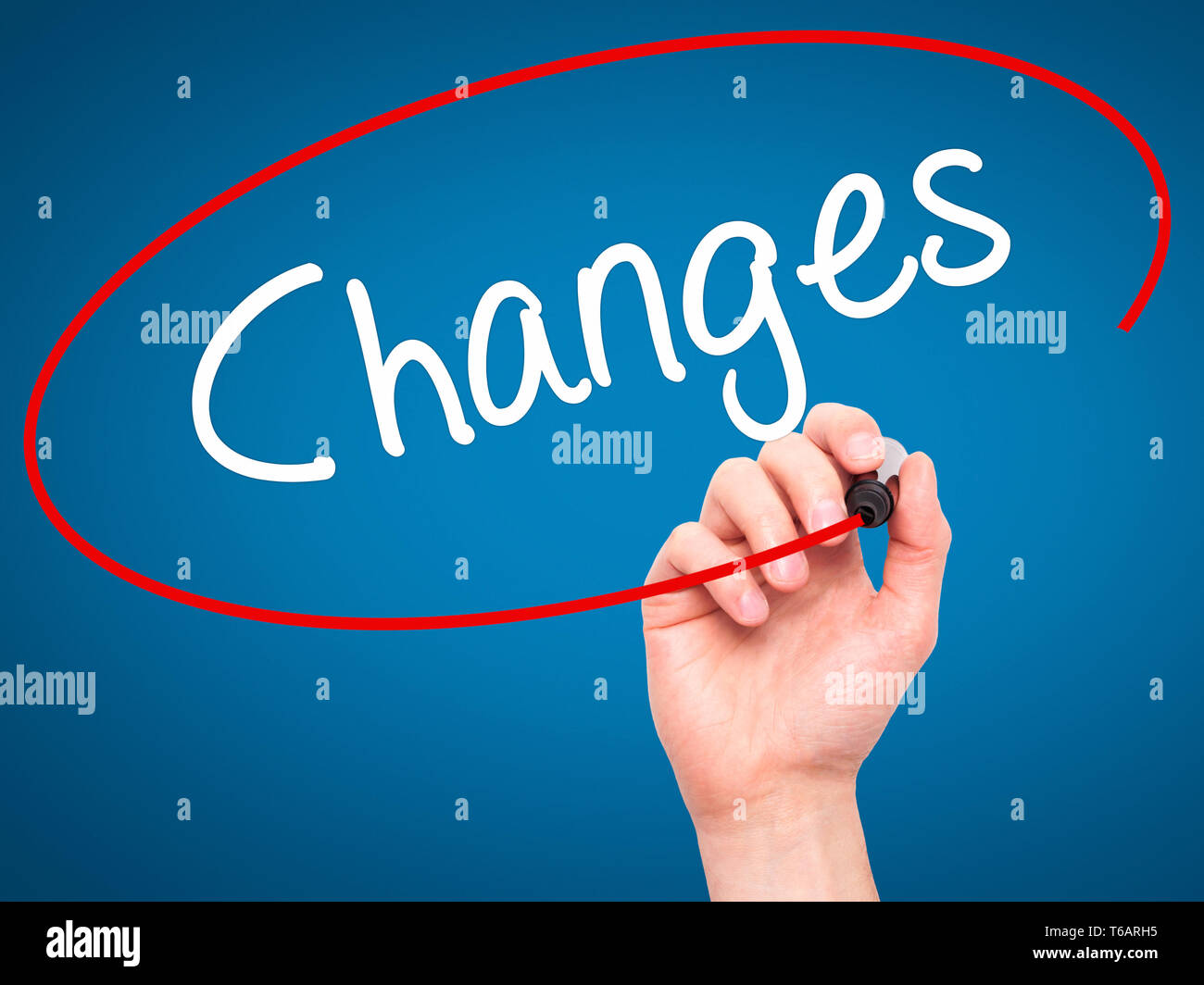 Man Hand writing Changes with black marker on visual screen Stock Photo ...