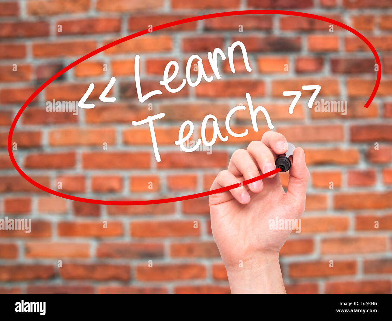 Man Hand writing Learn - Teach with black marker on visual screen Stock ...