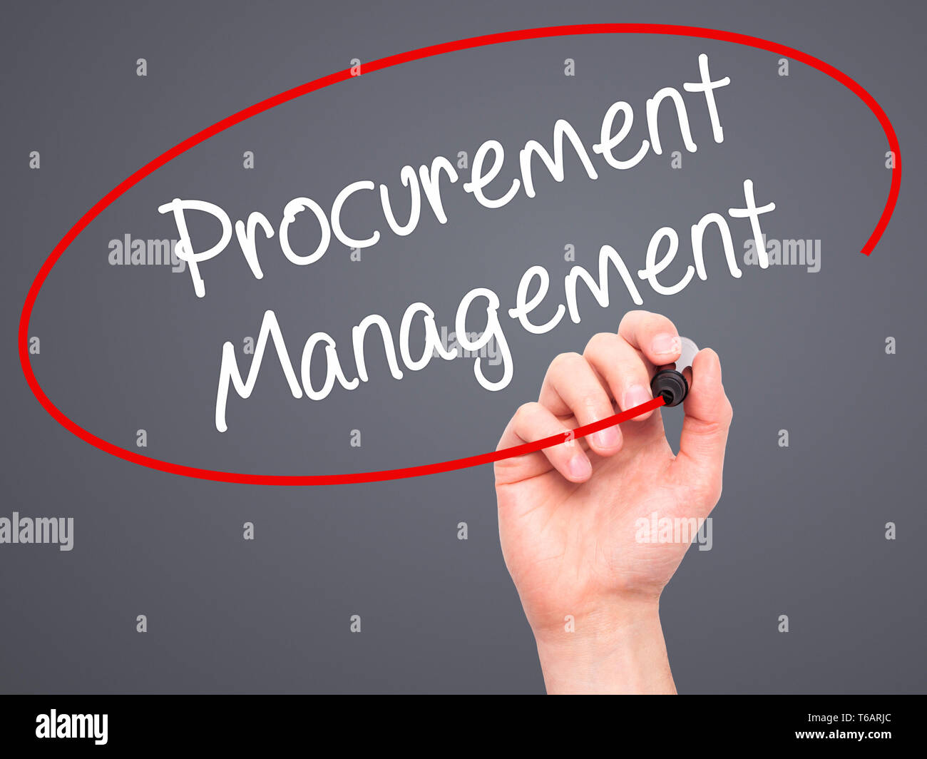 Man Hand writing Procurement Management with black marker on visual screen. Stock Photo