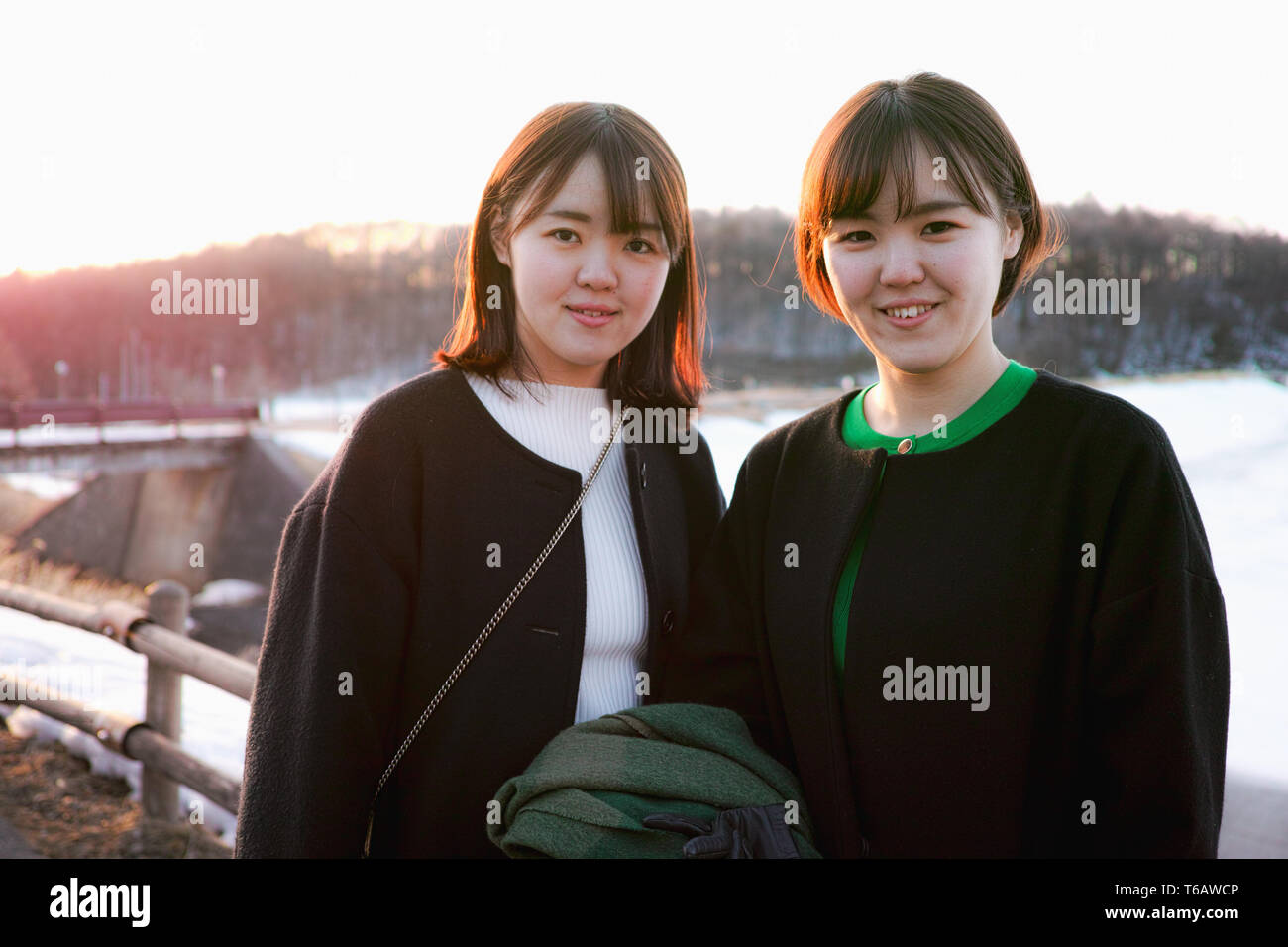 Two sisters posing for a snapshot in Winter Stock Photo