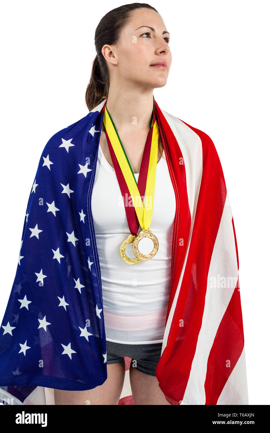 Athlete posing with american flag and gold medals around his neck Stock ...