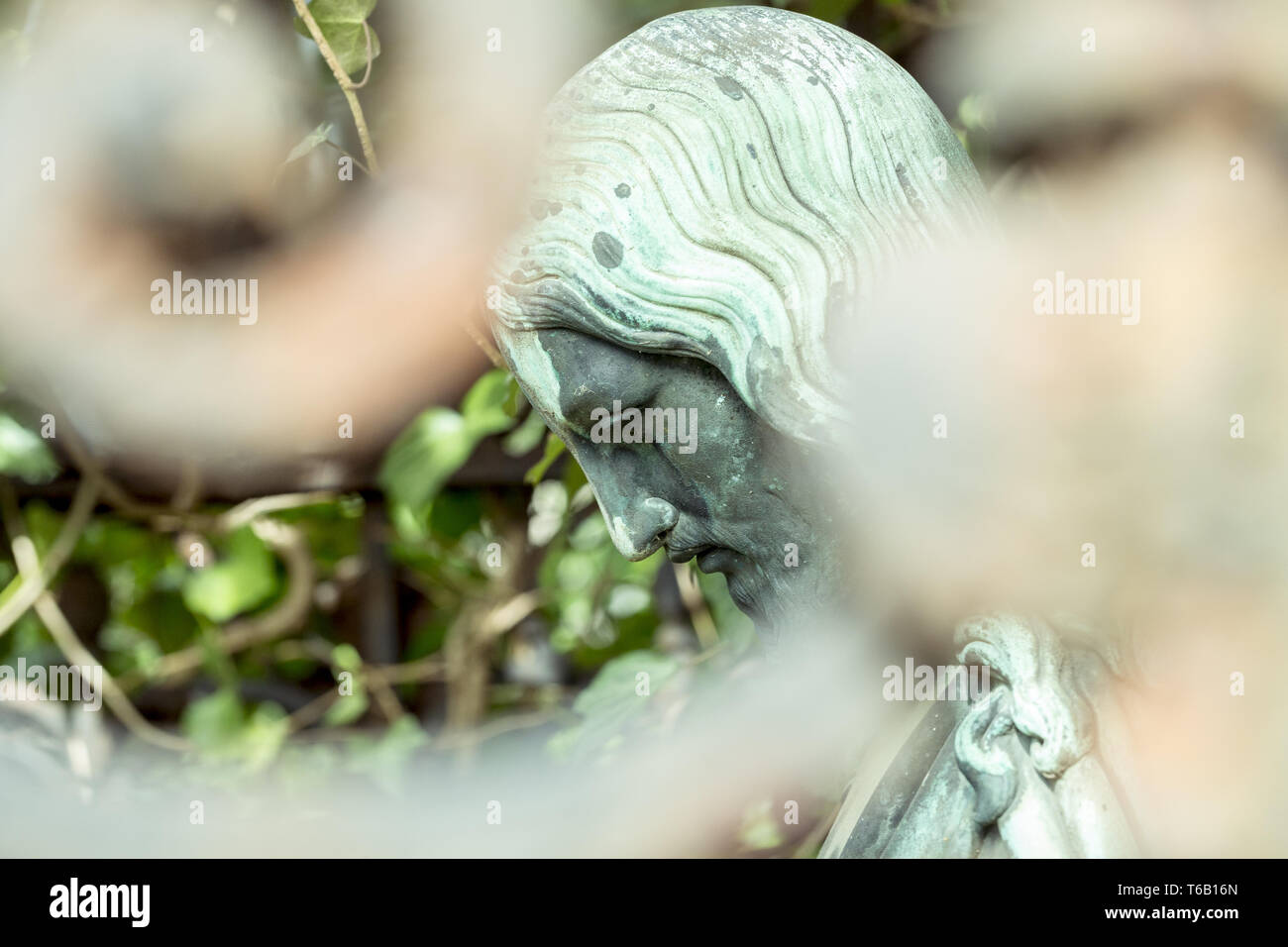 Jesus statue behind fence hires stock photography and images Alamy