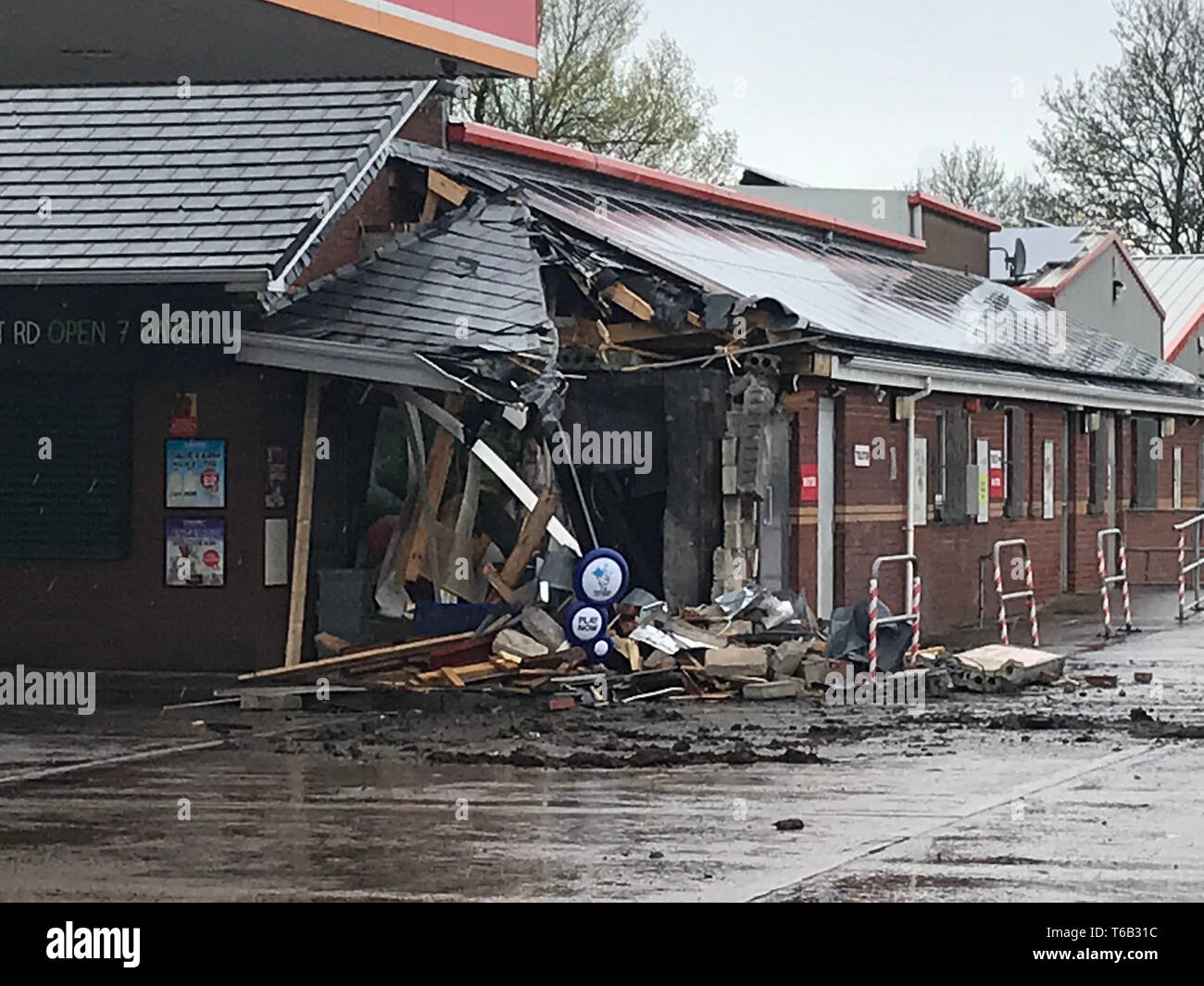 The scene at a fuel station at Tully Road, Nutts Corner, Antrim, where a digger was used to rip an ATM from the wall. Stock Photo
