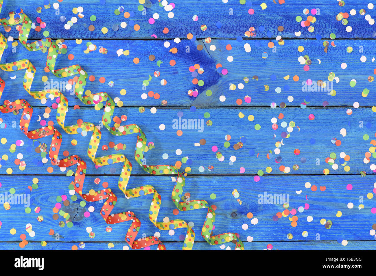 confetti and paper streamer at carnival Stock Photo - Alamy