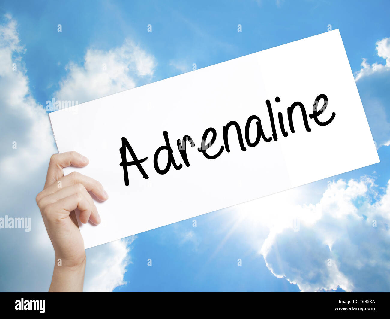 Adrenaline Sign on white paper. Man Hand Holding Paper with text ...