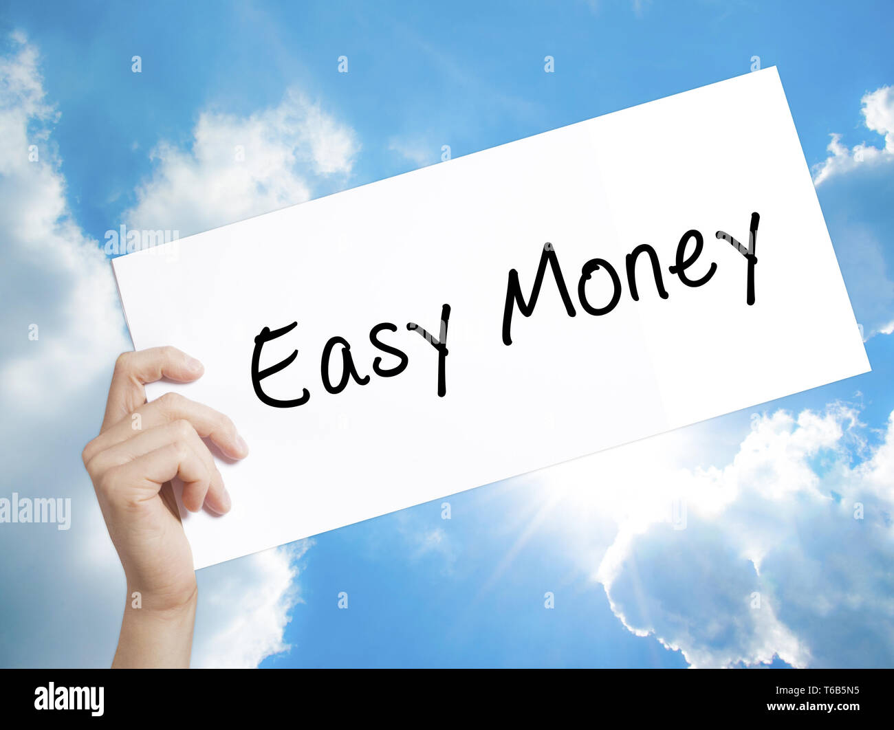 Easy Money Sign On White Paper Man Hand Holdin!   g Paper With Text - 