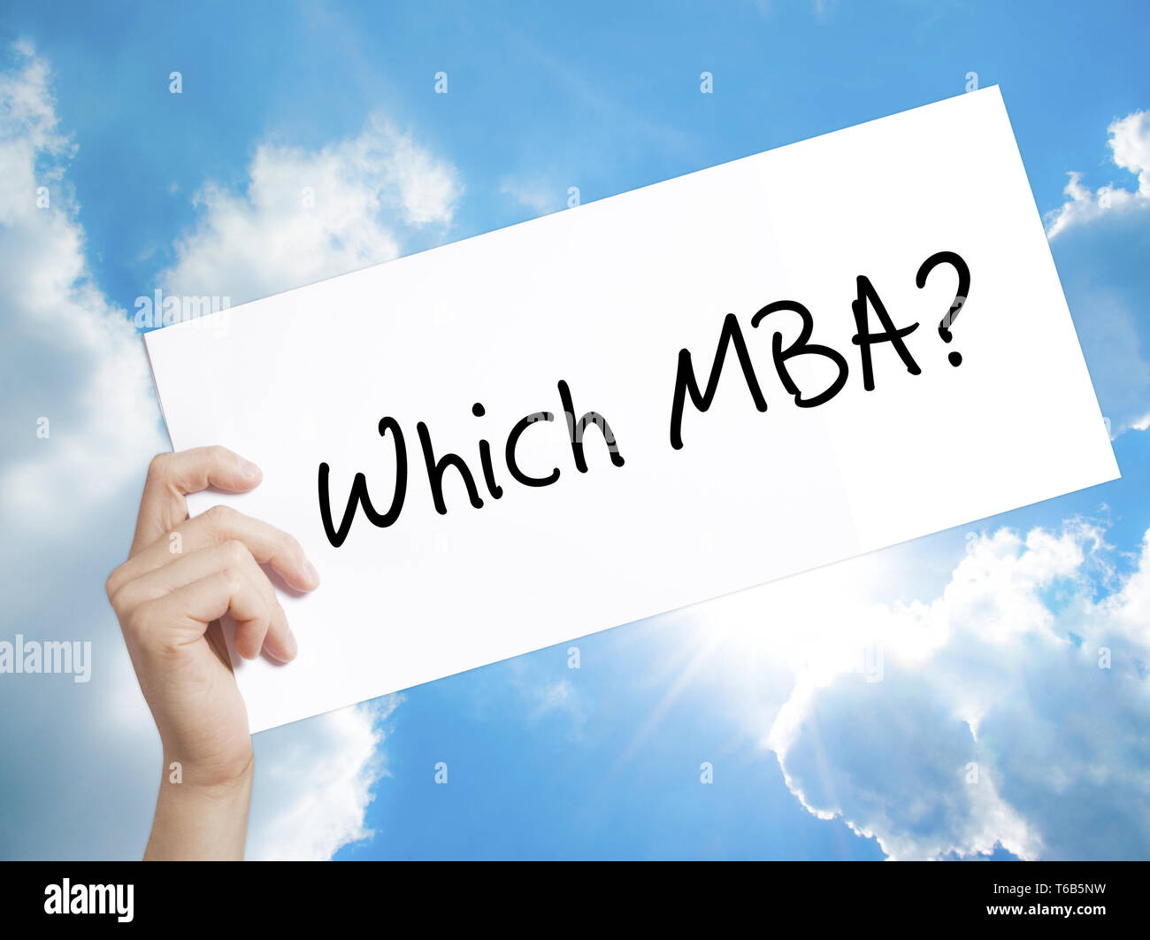 Which MBA? Sign on white paper. Man Hand Holding Paper with text. Isolated on sky background Stock Photo