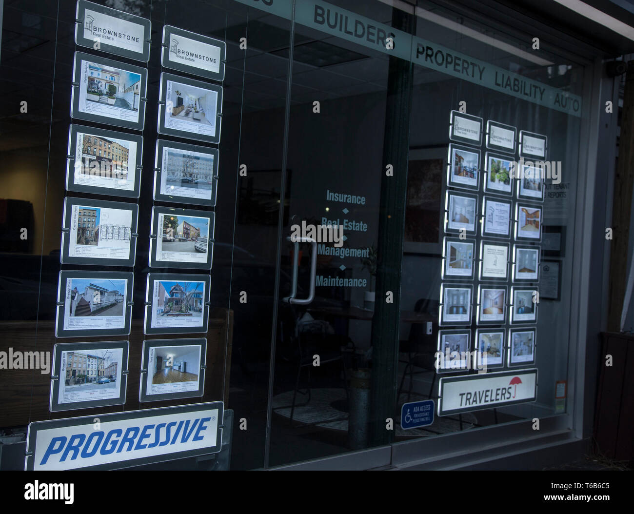 Real estate listings in a realty window in Brooklyn, New York Stock