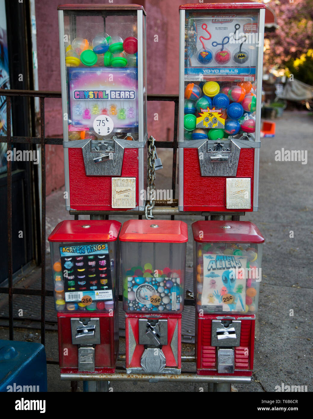 Gum ball vending machines in front of a store in Brooklyn, New York Stock Photo
