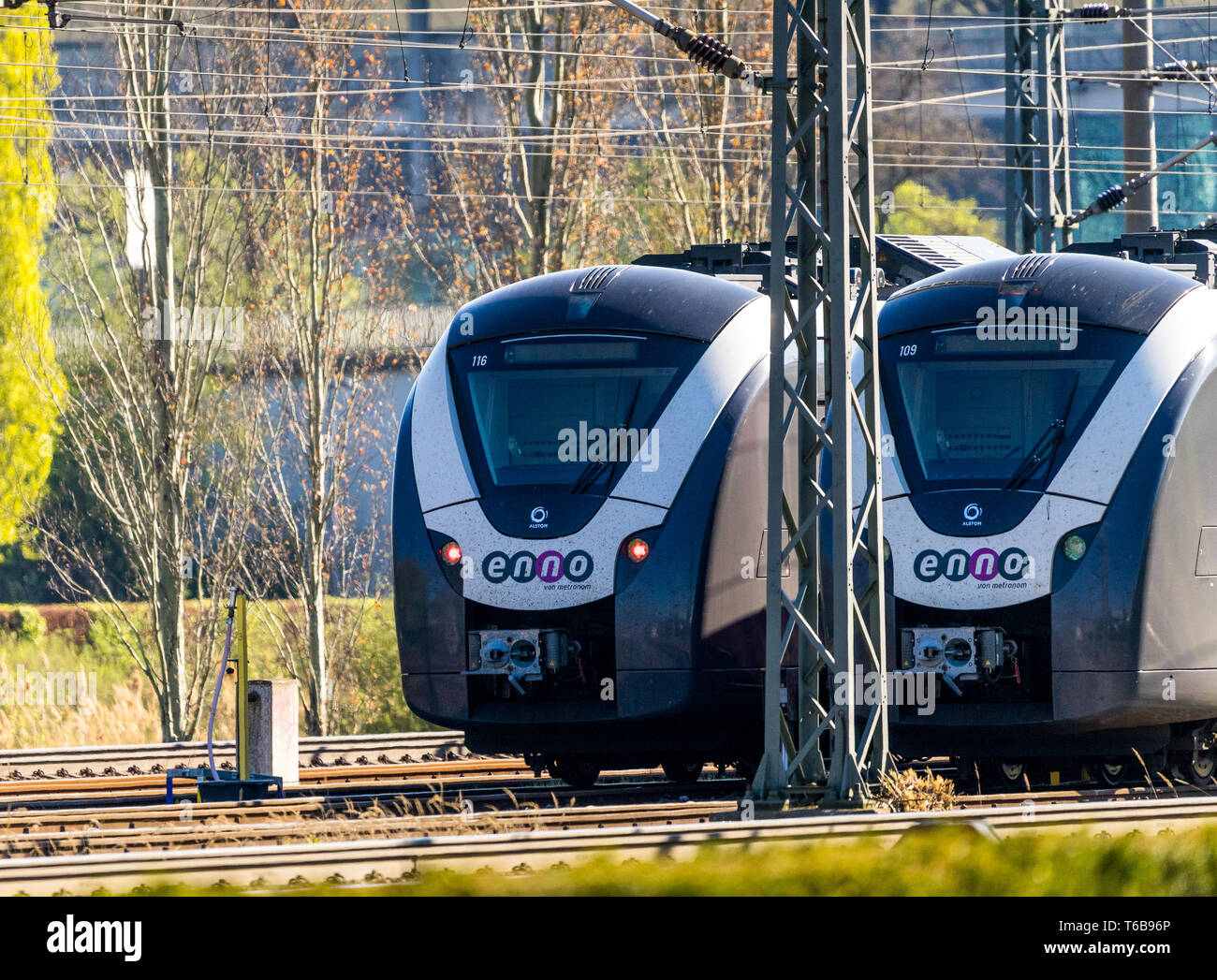 Two regional trains wait on the tracks for the signal for departure, Wolfsburg, Germany, April 20., 2019 Stock Photo