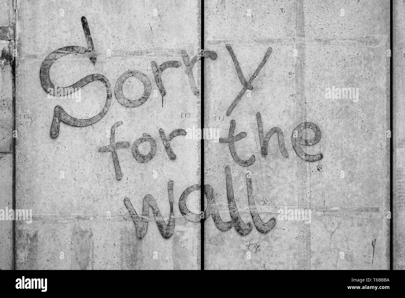 Concrete wall with the words Sorry for the Wall Stock Photo