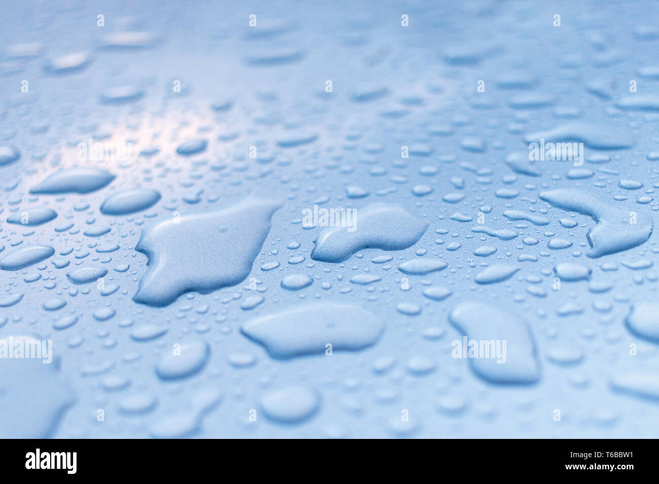 Raindrops on a metallic surface Stock Photo