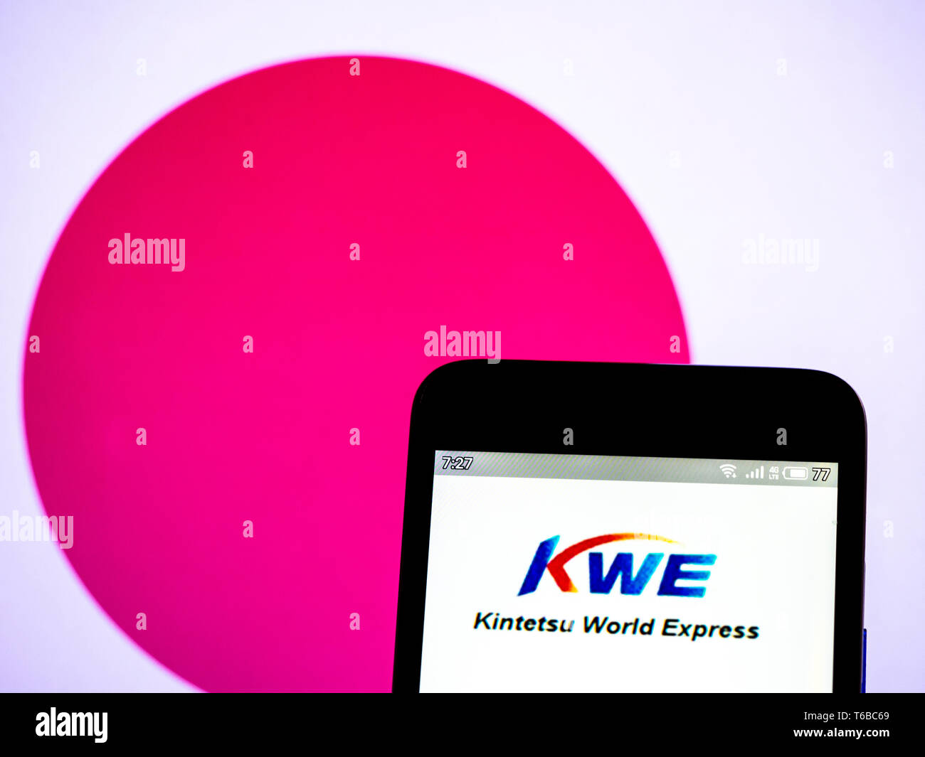 In this photo illustration a Kintetsu World Express, Inc. (KWE) logo seen displayed on a smart phone Stock Photo