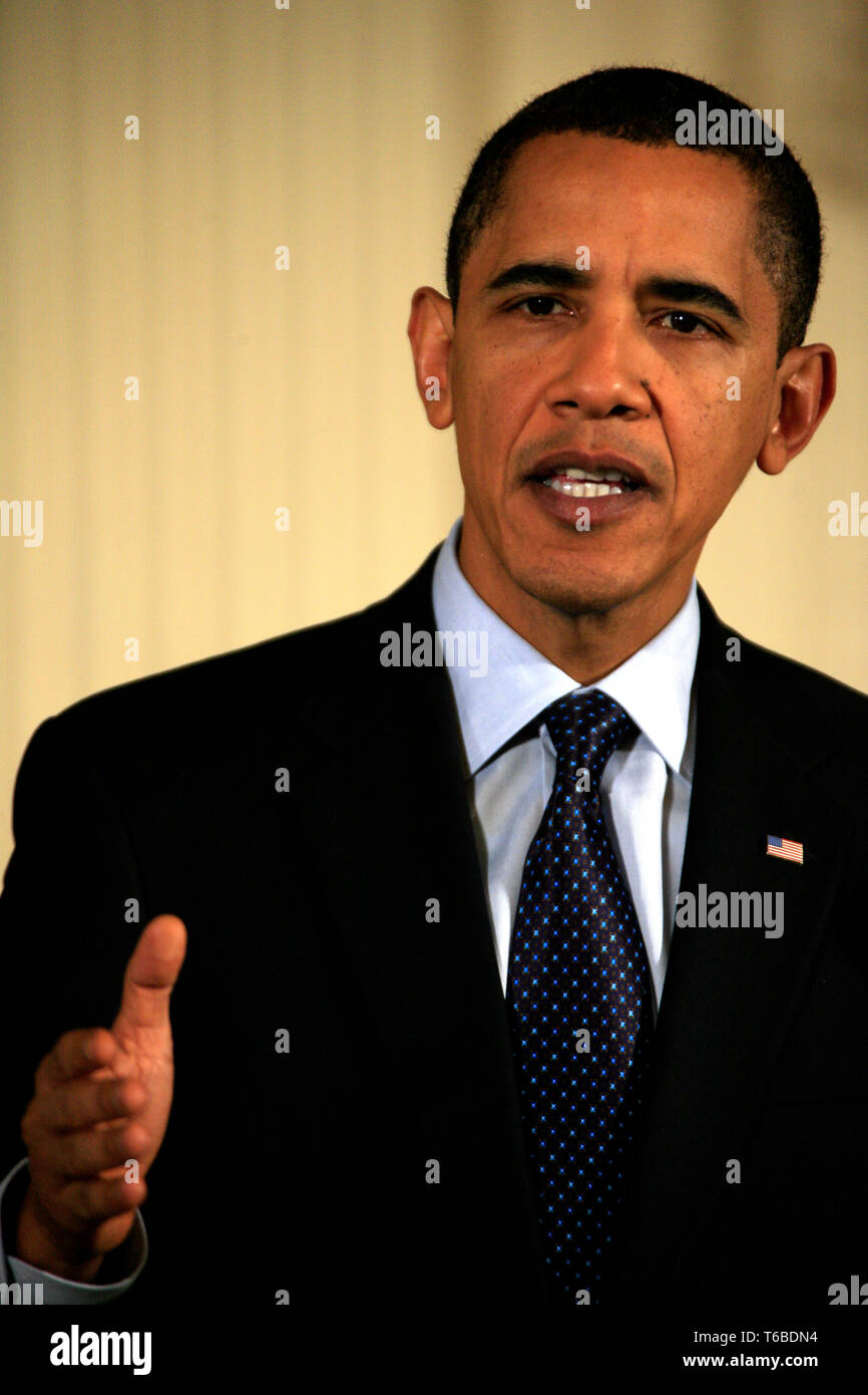 The President of the United States, Barack Obama, signs into law improved rights for veterans. Stock Photo
