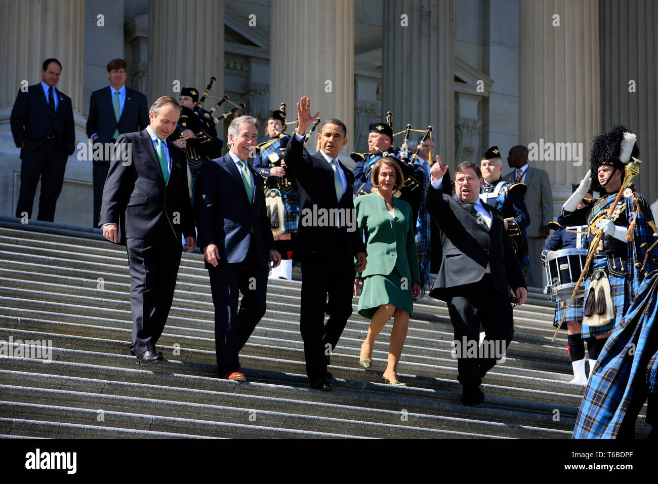 Speaker Nancy Pelosi and the 44th President of the United States, Barack Obama, join at the stairs of the US Capitol on St. Patricks Day after securing the Obamacare bill. Stock Photo