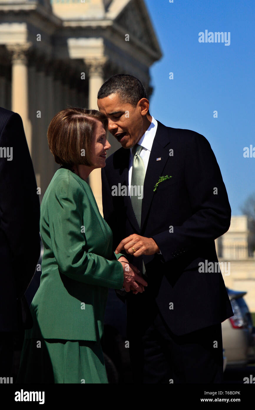 Speaker Nancy Pelosi and the 44th President of the United States, Barack Obama, join at the stairs of the US Capitol on St. Patricks Day after securing the Obamacare bill. Stock Photo