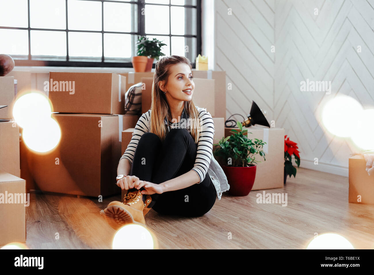 Girl is moving to new home Stock Photo