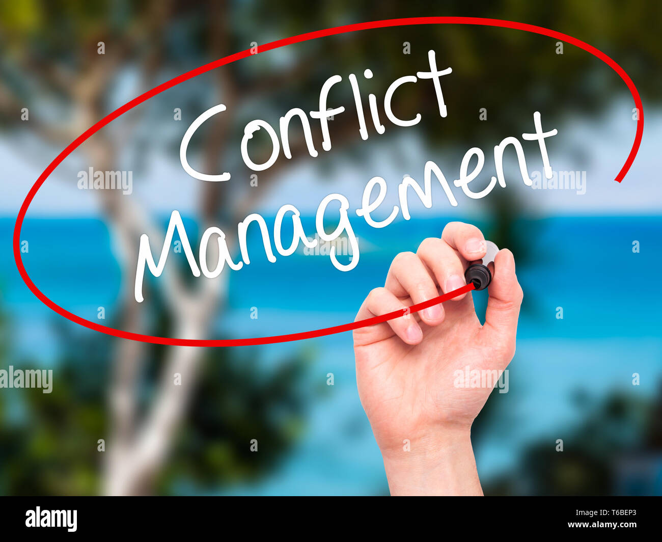 Man Hand writing Conflict Management with black marker on visual screen. Stock Photo