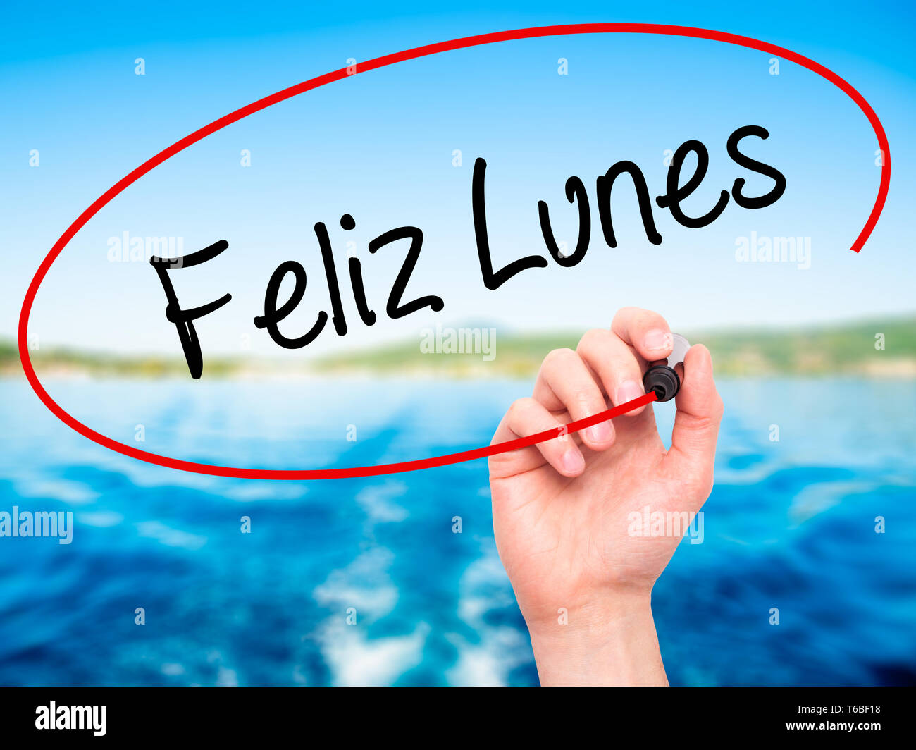 Man Hand Writing Feliz Lunes Happy Monday In Spanish With Black Marker On Visual Screen Stock Photo Alamy