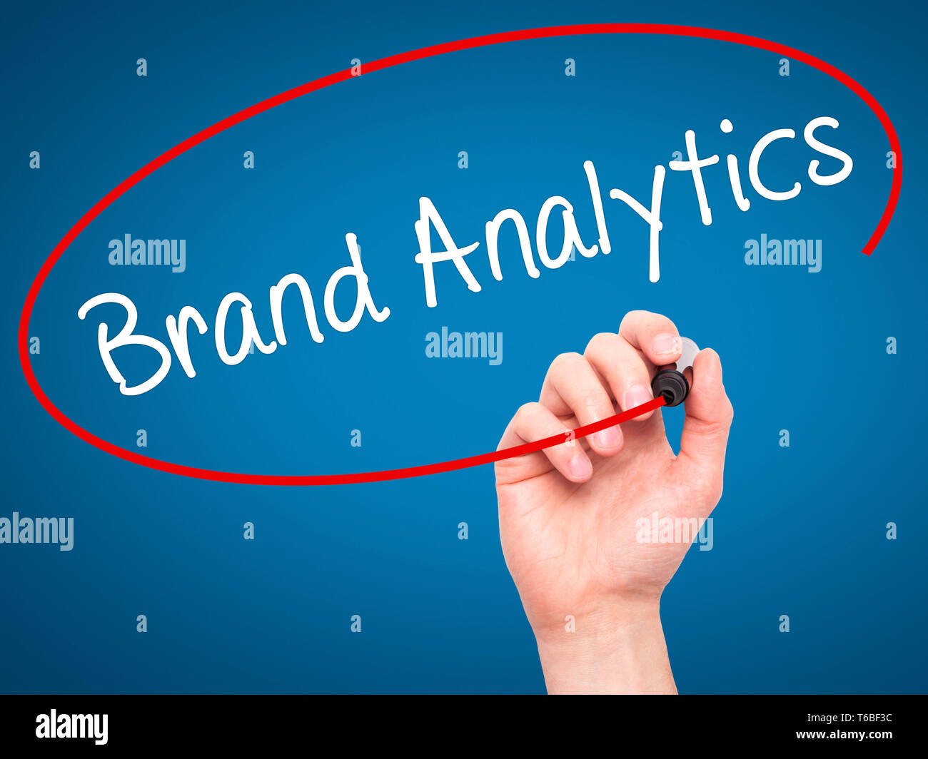 Man Hand writing Brand Analytics with black marker on visual screen Stock Photo