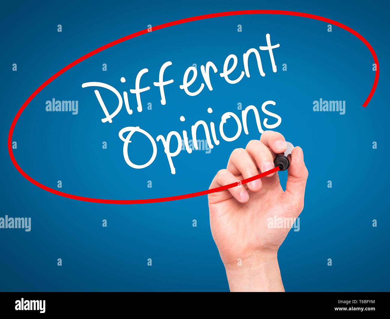 Man Hand writing Different Opinions with black marker on visual screen. Stock Photo
