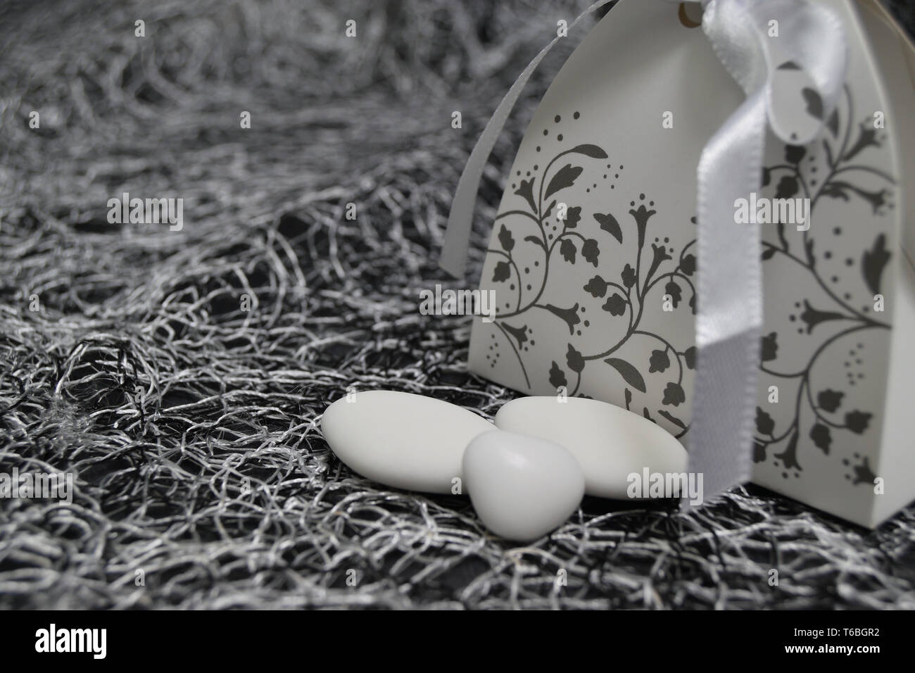 wedding dress shaped box with almond confetti inside Stock Photo Alamy