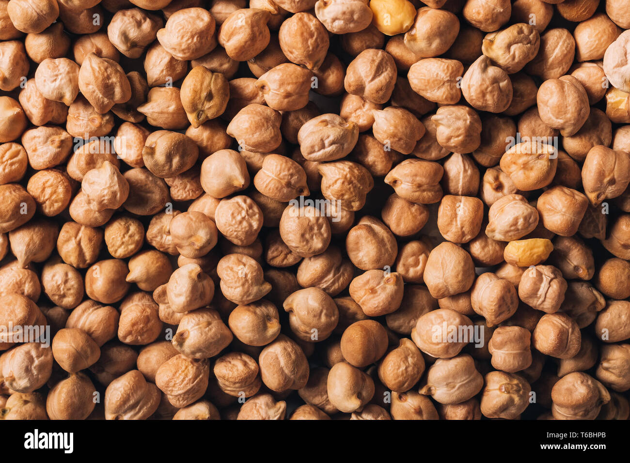 Raw chickpeas as organic texture, top view background Stock Photo