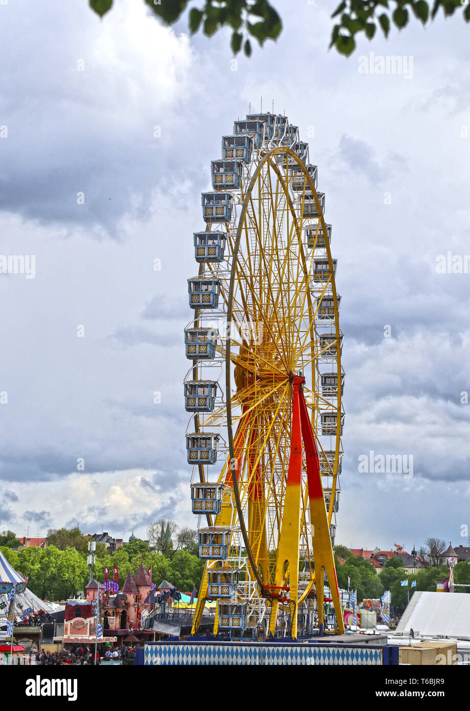 MUNICH, GERMANY -Giant ferris wheel with Bavarian style booths at ...