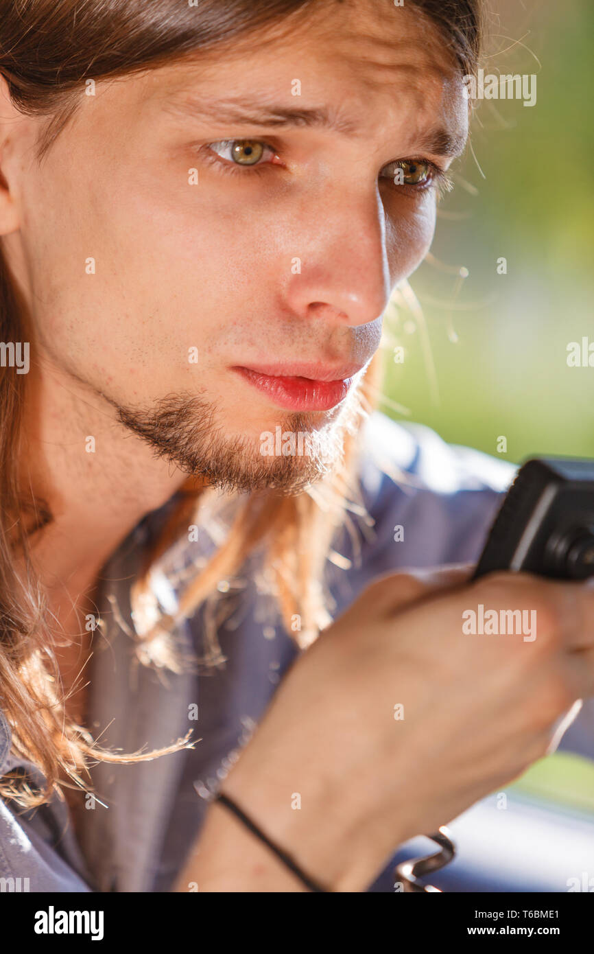 Talking while drive, auto walkie talkie, comunication concept. Young