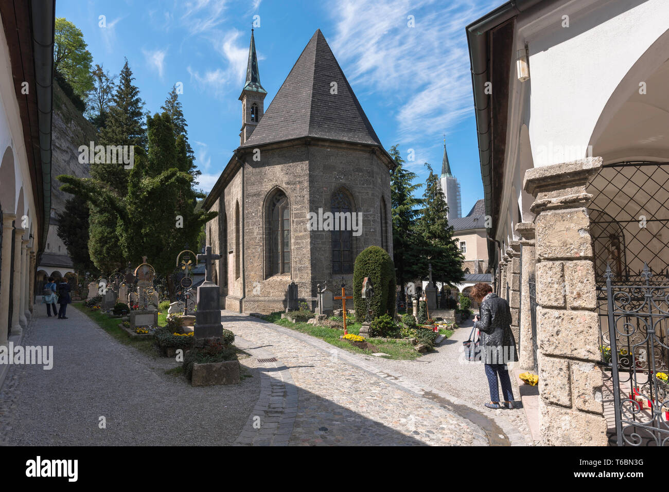 Salzburg cemetery, view of the Petersfriedhof Cemetery and rear of the Margarethenkapelle in the Old Town (Altstadt) quarter of Salzburg, Austria. Stock Photo