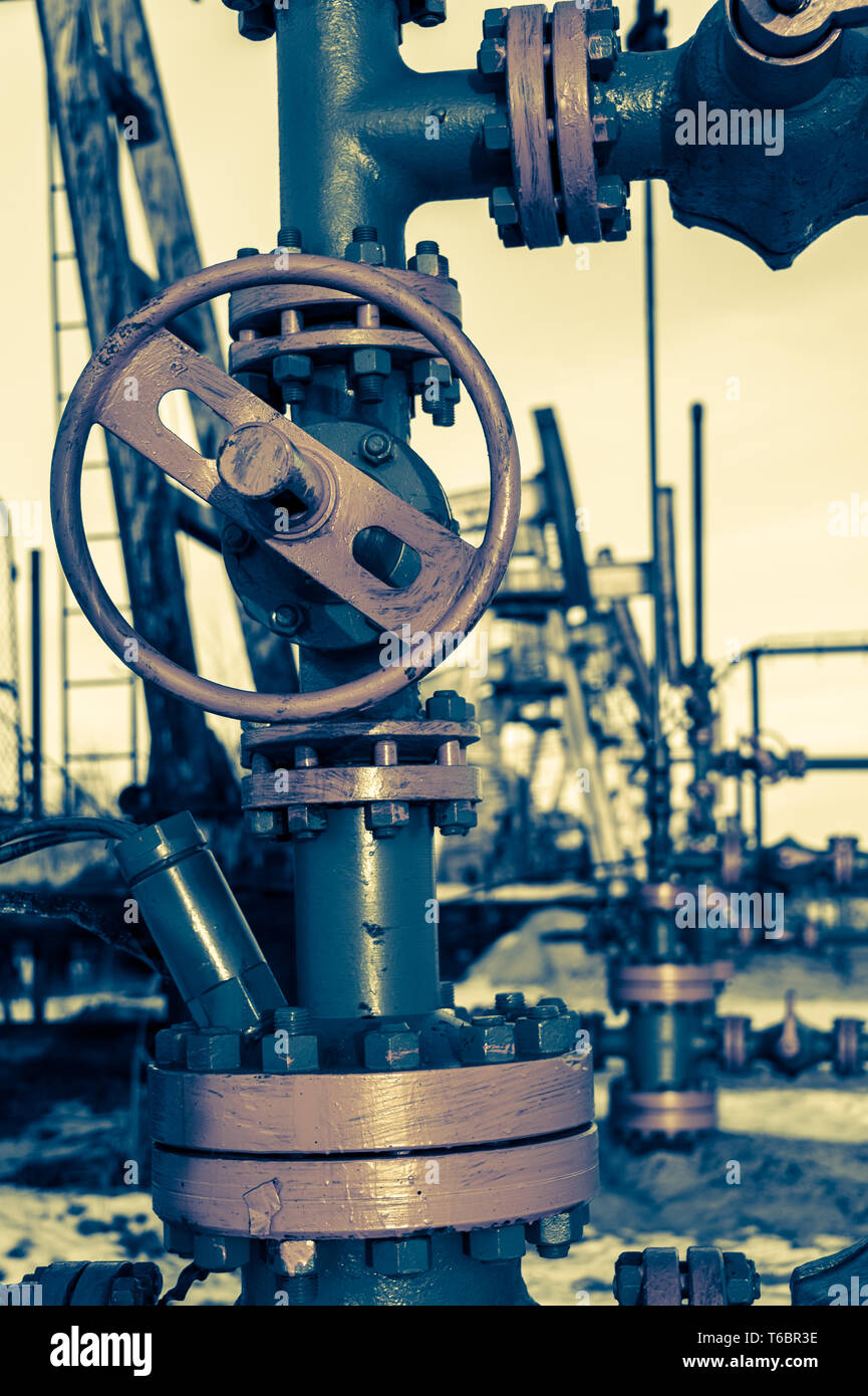 Group of wellhead. Oilfield with sand ground Stock Photo Alamy