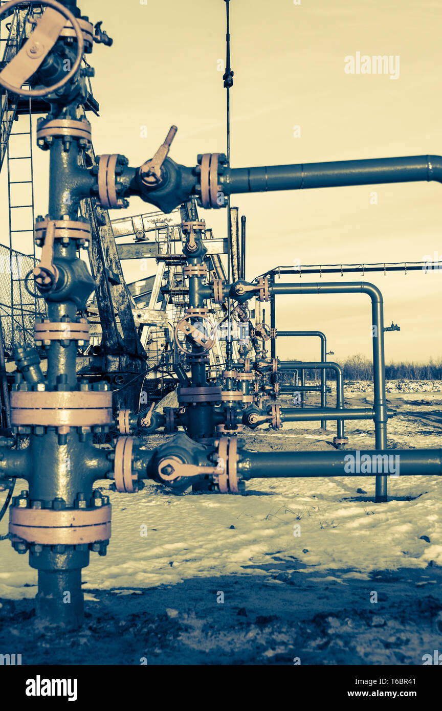 Group of wellhead. Oilfield with sand ground Stock Photo Alamy