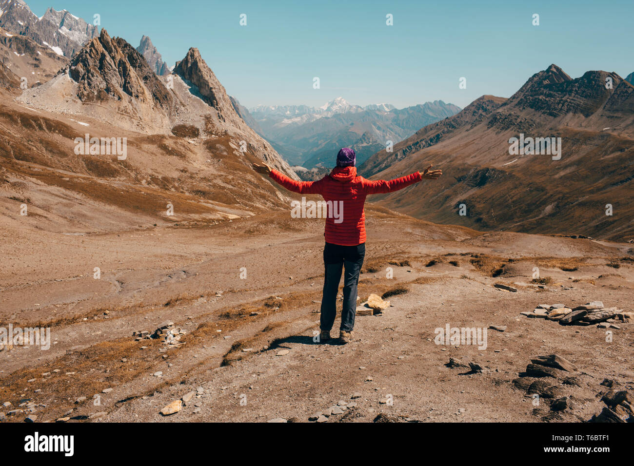 tourist standing at mountain pass between Switzerland and Italy, Col de la Seigne Stock Photo