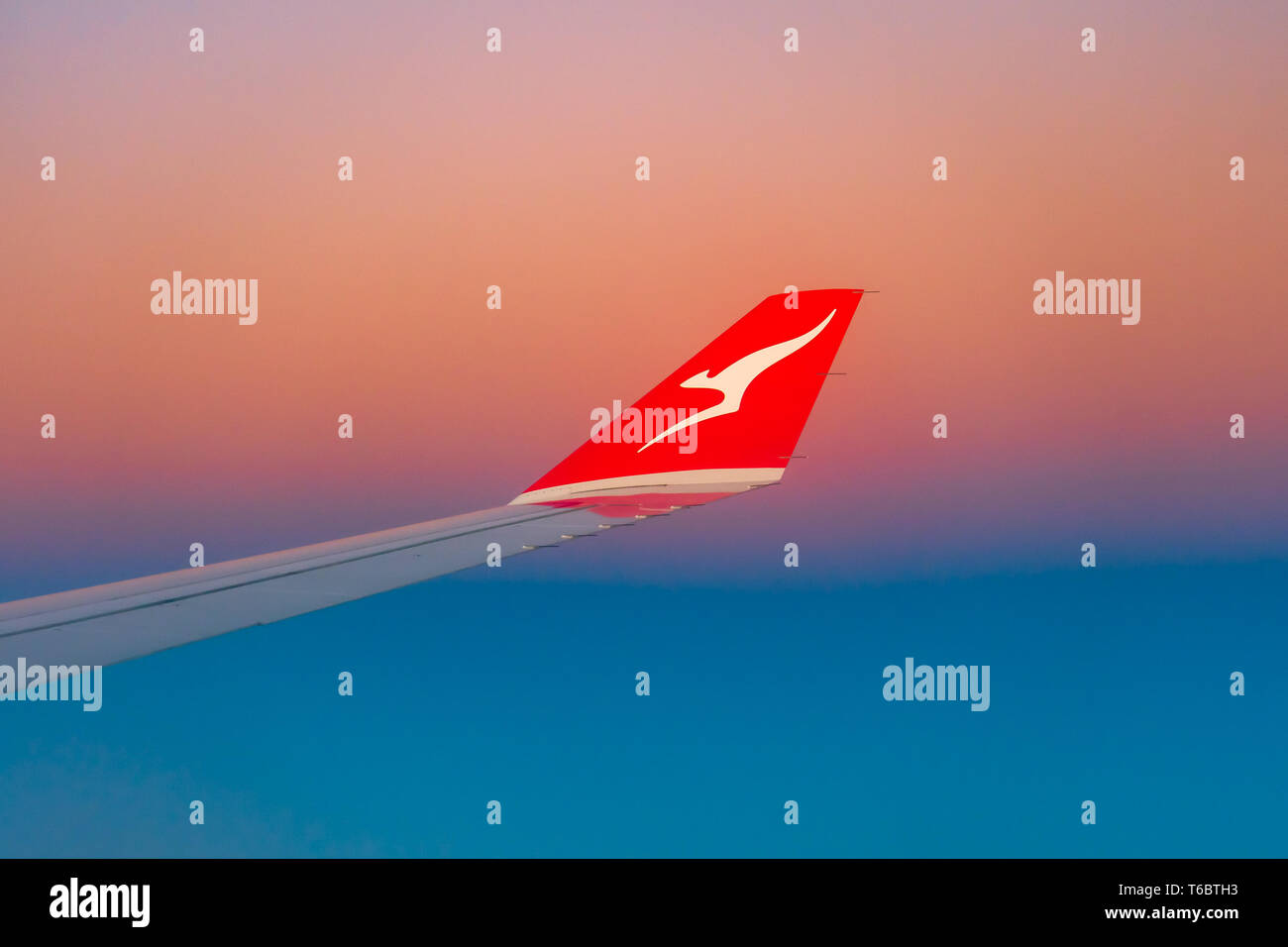 Qantas plane wing at sunrise Stock Photo