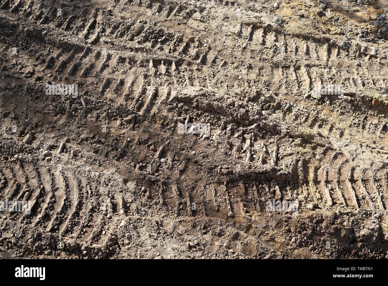 Tire tracks of construction vehicles on a construction site Stock Photo