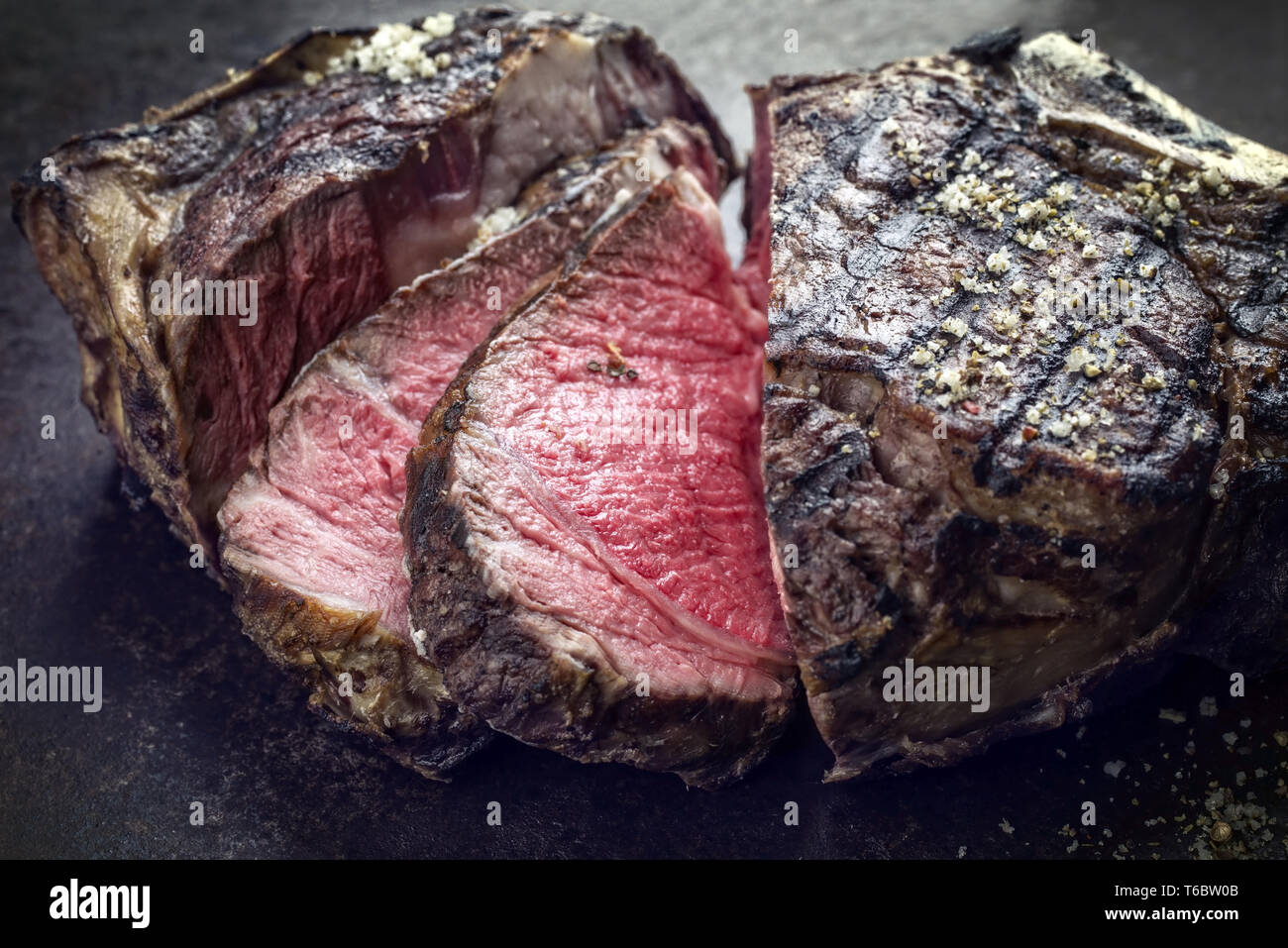 Barbecue dry aged Cote de Boeuf as closeup on a rusty metal sheet Stock Photo Alamy