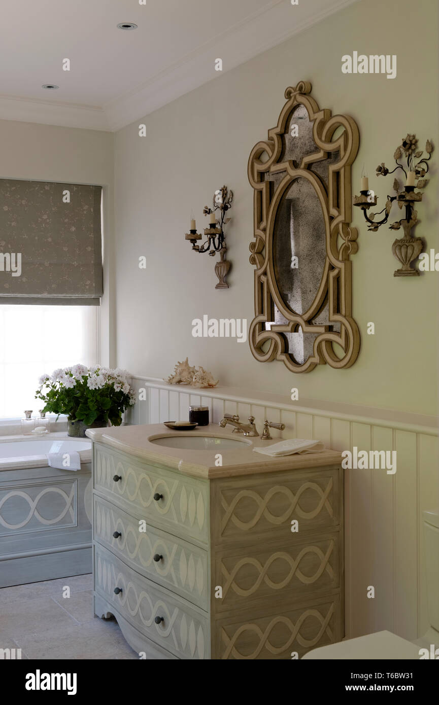Ornate Mirror And Candle Holders In Bathroom Stock Photo