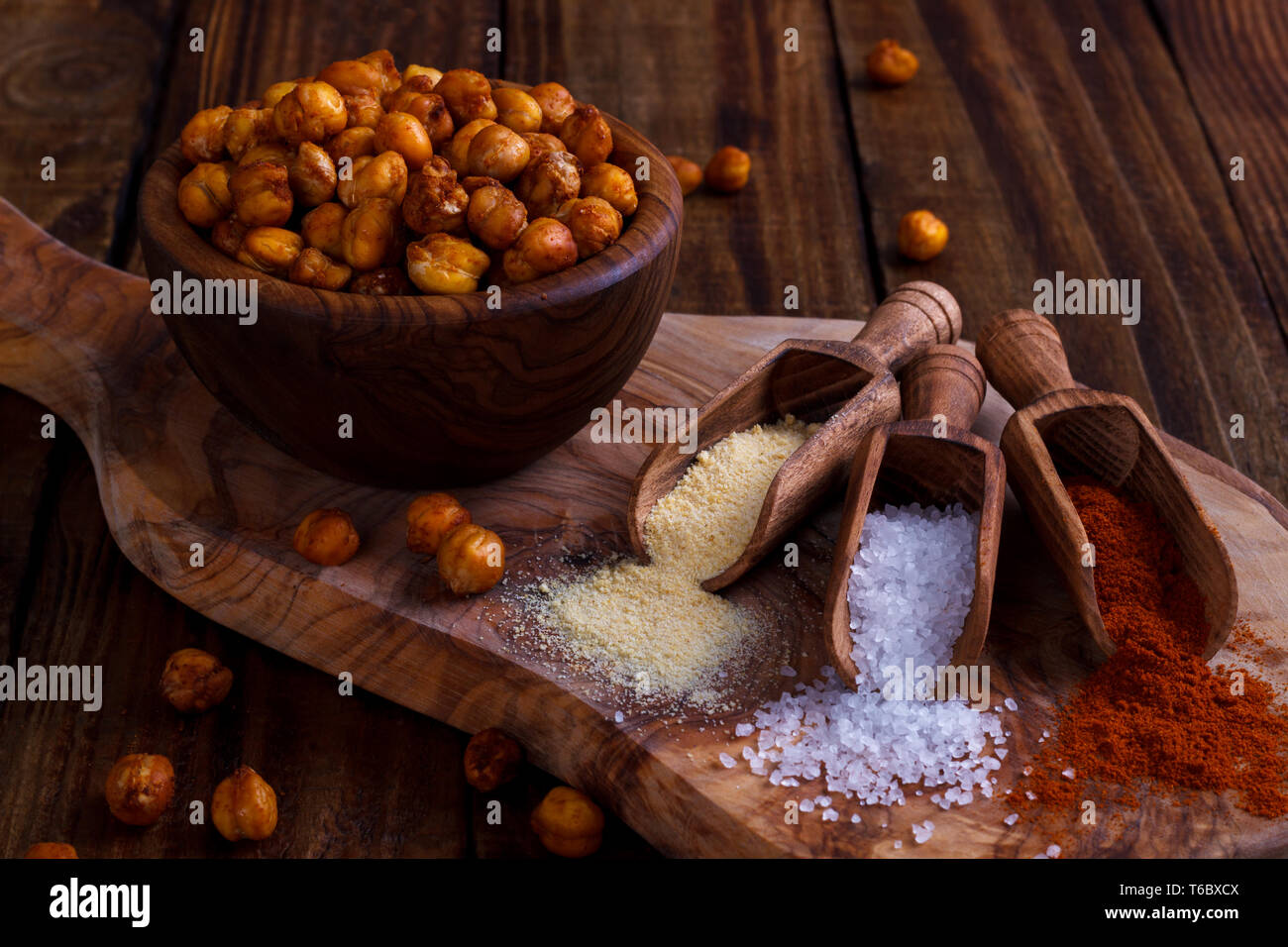 Roasted spicy chickpeas on rustic background Stock Photo