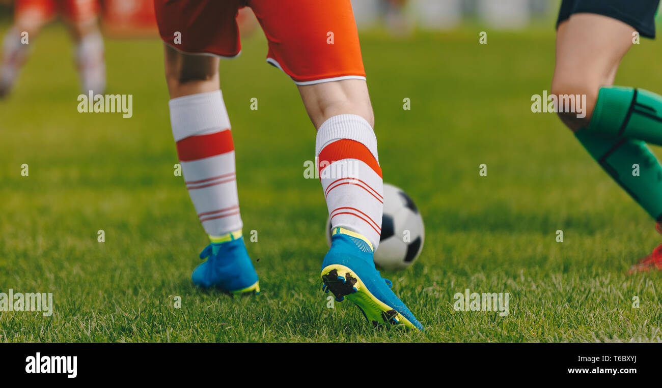 Soccer football kickoff in the stadium. Sporty player running and