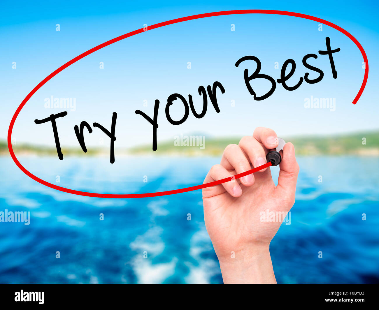 Man Hand writing Try your Best with black marker on visual screen. Stock Photo