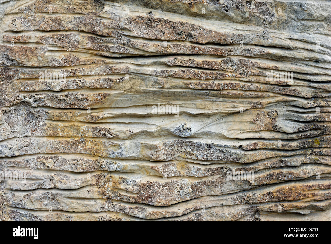 Backgrounds and textures: aged stone surface, exterior wall of rustic building Stock Photo