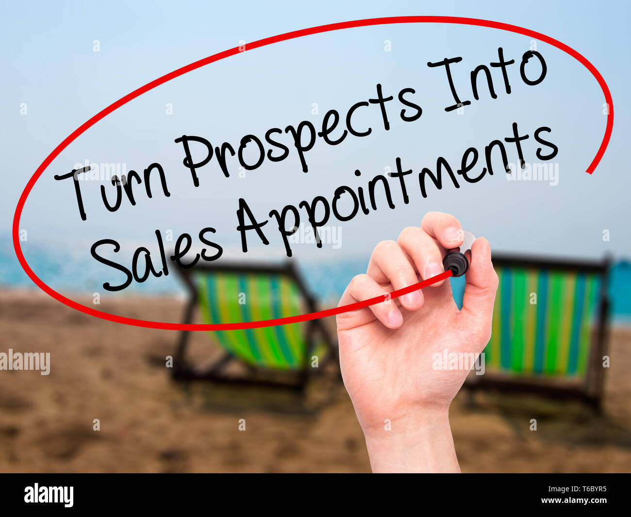 Man Hand writing Turn Prospects Into Sales Appointments with black marker on visual screen. Stock Photo
