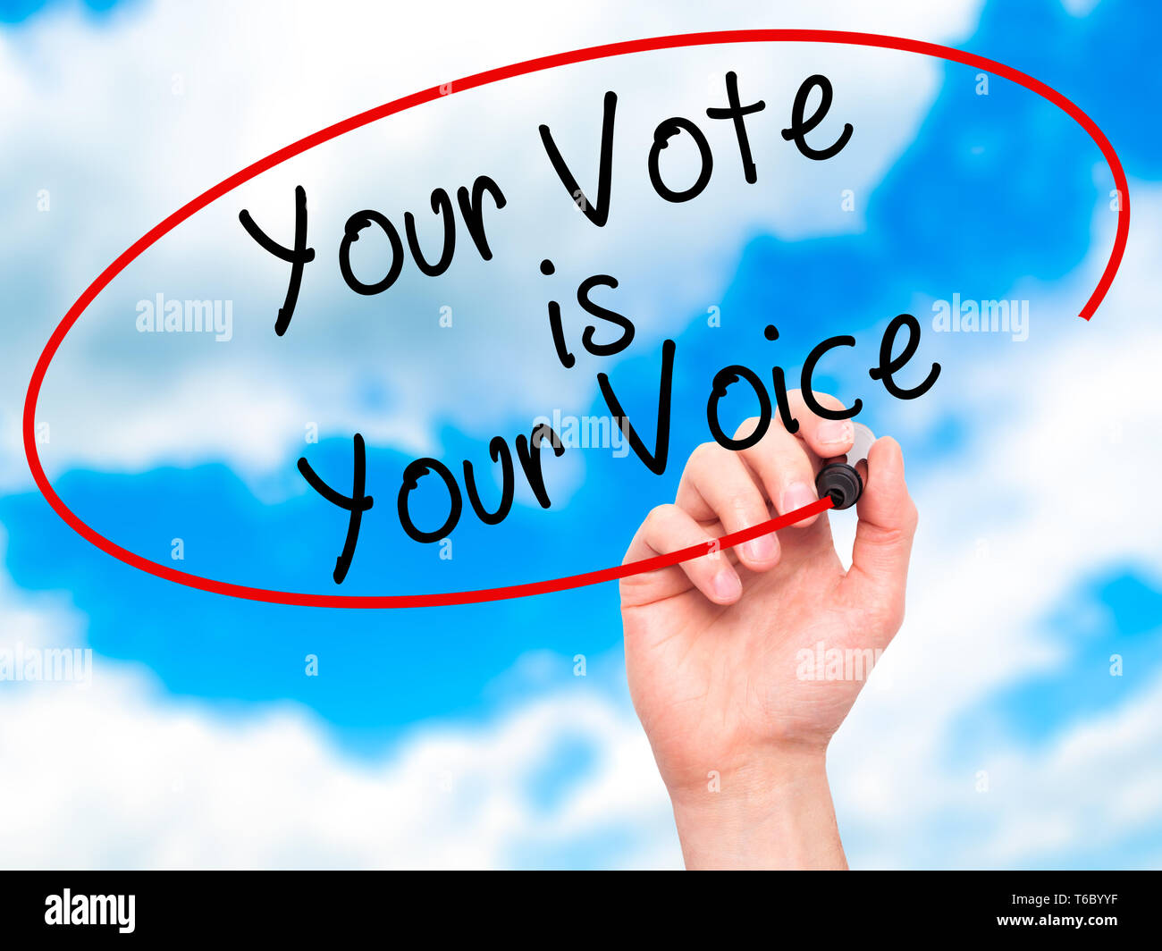 Man Hand writing Your Vote is Your Voice with black marker on visual ...