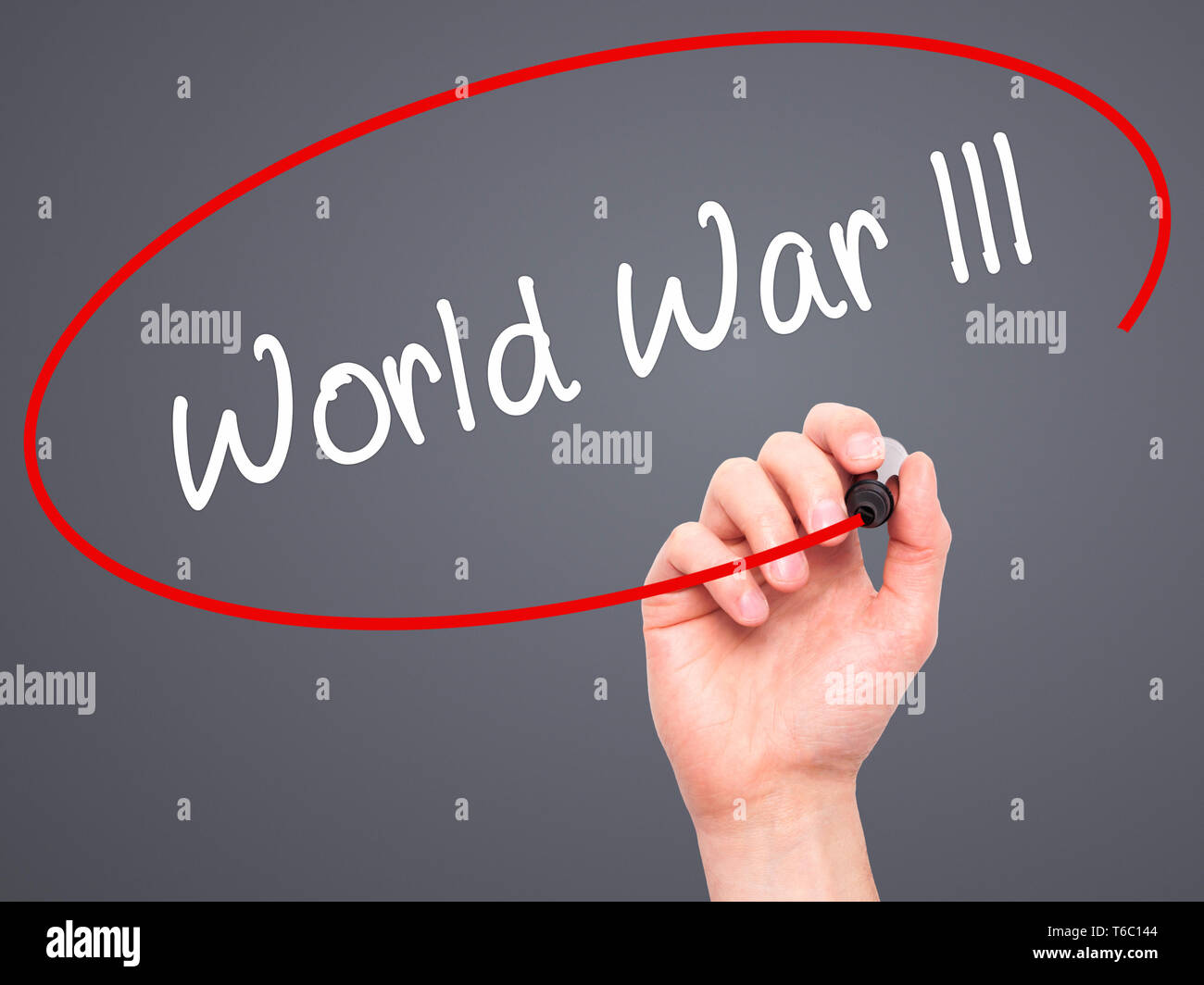 Man Hand writing World War lll with black marker on visual screen Stock Photo