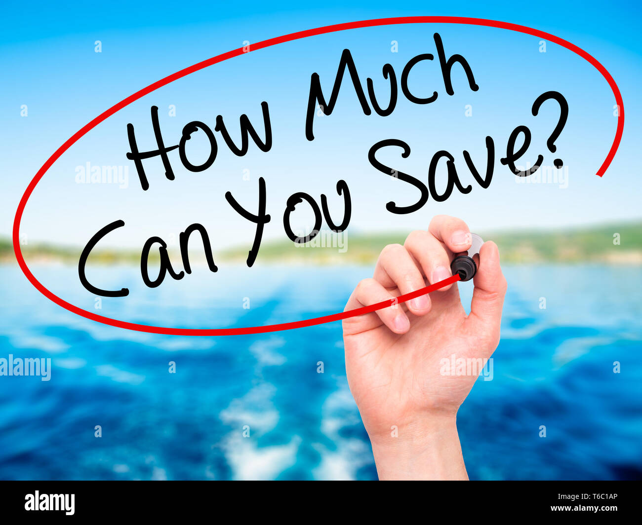Man Hand writing How Much Can You Save? with black marker on visual screen Stock Photo